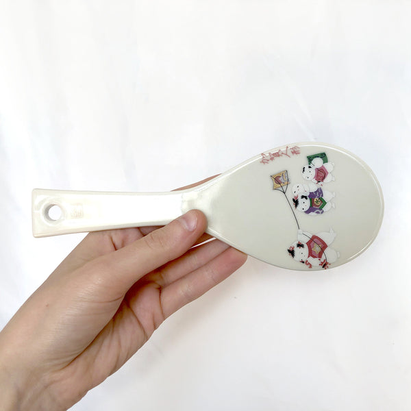 Decorative Japanese rice paddle - ceramic with an image of playful children